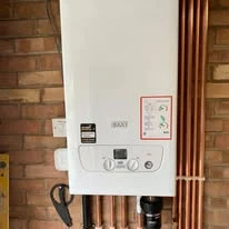 Newly installed Baxi combi boiler with neat copper pipework