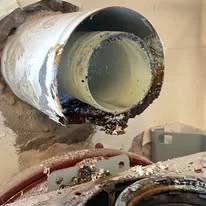 Corroded boiler flue found during a gas safety inspection