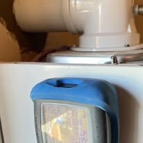 Gas Safe engineer inspecting a boiler flue connection