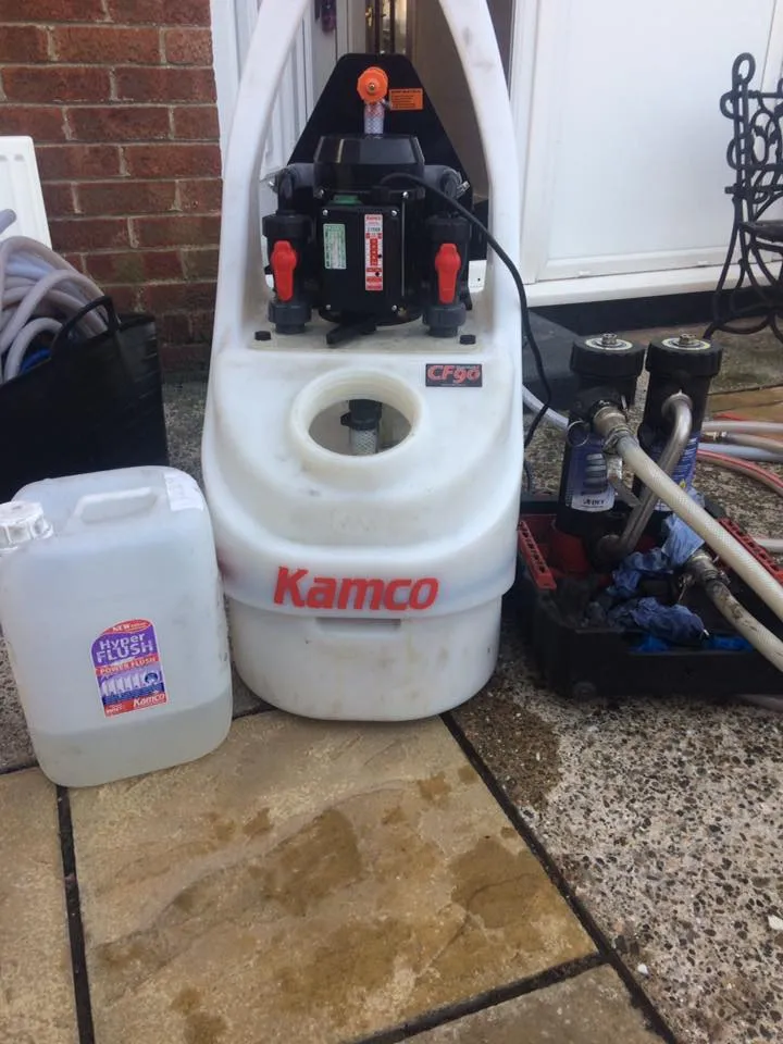 Kamco power flushing machine connected to a central heating system outside a house in Hull